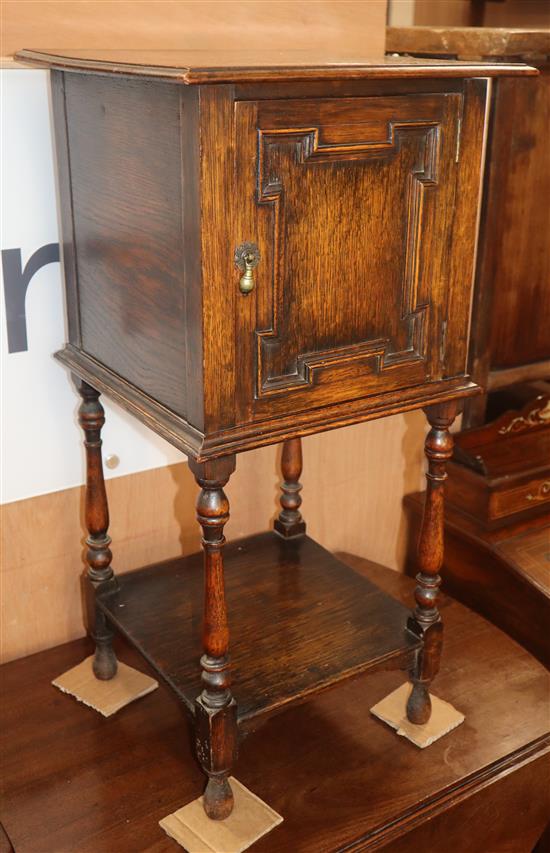 A small 1920s oak bedside cabinet